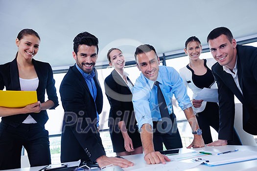 Group of happy young business people in a meeting at office Group of happy young business people in a meeting at office