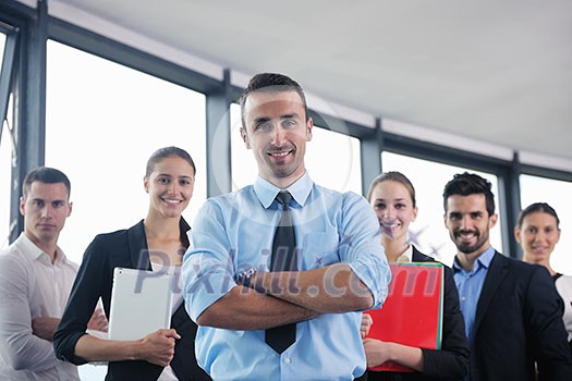 Group of happy young business people in a meeting at office Group of happy young business people in a meeting at office