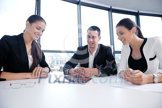 Group of happy young business people in a meeting at office Group of happy young business people in a meeting at office