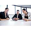 Group of happy young  business people in a meeting at office