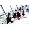 Group of happy young  business people in a meeting at office
