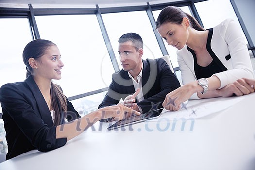 Group of happy young business people in a meeting at office Group of happy young business people in a meeting at office