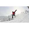 Snowboarder doing a jump and free ride on  powder snow at winter season