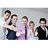 Group of young business people sitting in board room during meeting and discussing with paperwork