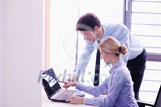 Group of happy young business people in a meeting at office Group of happy young business people in a meeting at office