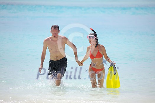 happy young romantic couple in love have fun running and relaxing on beautiful beach