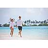 happy young romantic couple in love have fun running and relaxing on beautiful beach