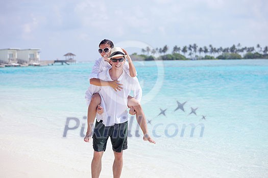 happy young romantic couple in love have fun running and relaxing on beautiful beach