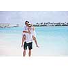 happy young romantic couple in love have fun running and relaxing on beautiful beach