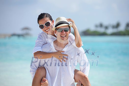 happy young romantic couple in love have fun running and relaxing on beautiful beach happy young romantic couple in love have fun running and relaxing on beautiful beach