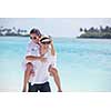 happy young romantic couple in love have fun running and relaxing on beautiful beach