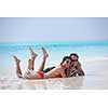 happy young romantic couple in love have fun running and relaxing on beautiful beach