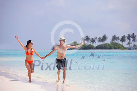 happy young romantic couple in love have fun running and relaxing on beautiful beach happy young romantic couple in love have fun running and relaxing on beautiful beach