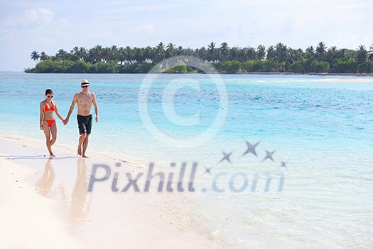 happy young romantic couple in love have fun running and relaxing on beautiful beach happy young romantic couple in love have fun running and relaxing on beautiful beach