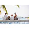 happy young couple relax and take fresh drink at summer vacation