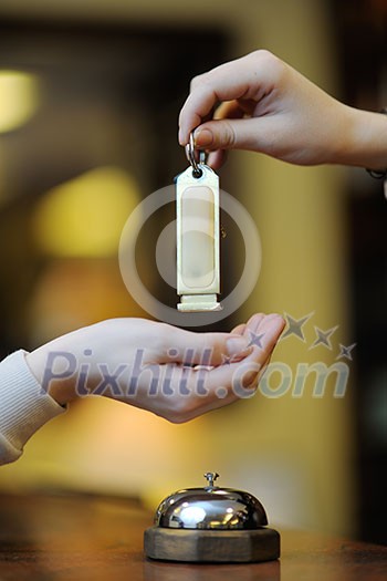business woman at the reception of a hotel checking in business woman at the reception of a hotel checking in