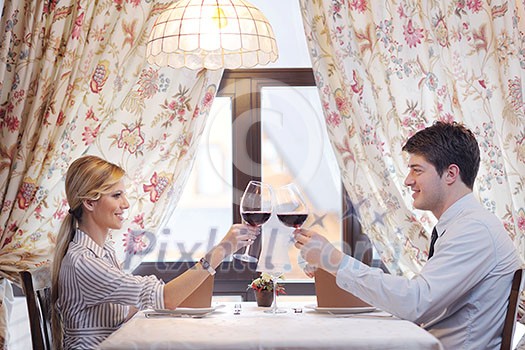 A young couple having dinner at a restaurant A young couple having dinner at a restaurant