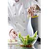 beautiful young chef woman prepare and decorating tasty food in kitchen