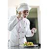 beautiful young chef woman prepare and decorating tasty food in kitchen