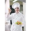 beautiful young chef woman prepare and decorating tasty food in kitchen