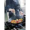 beautiful young chef woman prepare and decorating tasty food in kitchen