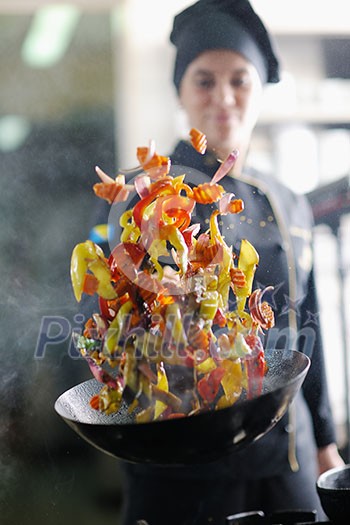 beautiful young chef woman prepare and decorating tasty food in kitchen beautiful young chef woman prepare and decorating tasty food in kitchen