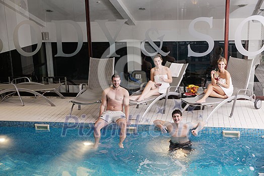 happy young people group have fun at swimming pool on spa and wellness center happy young people group have fun at swimming pool on spa and wellness center