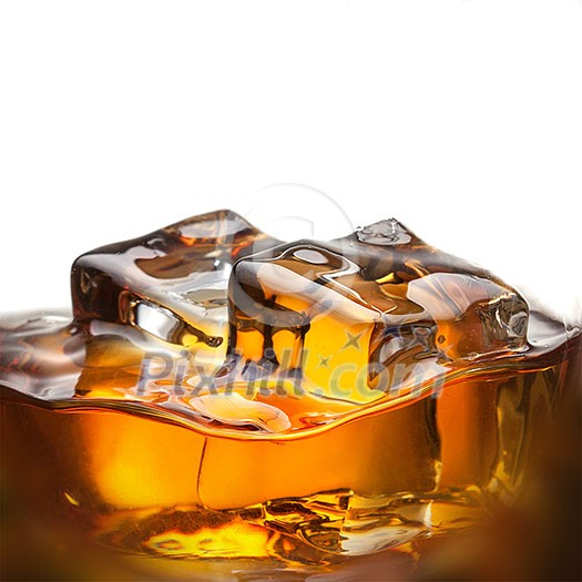 Splash of whiskey with ice in glass isolated on white background Splash of whiskey with ice in glass isolated on white background