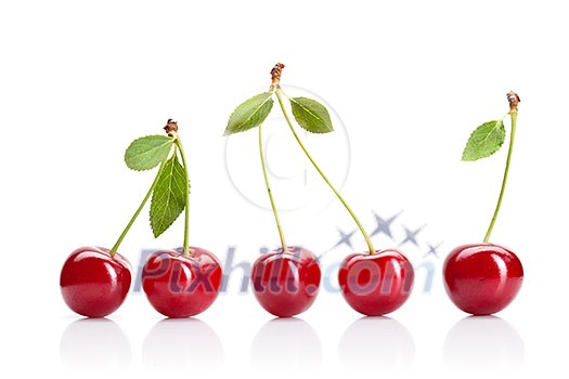 Red cherry with leaves isolated on white Red cherry with leaves isolated on white