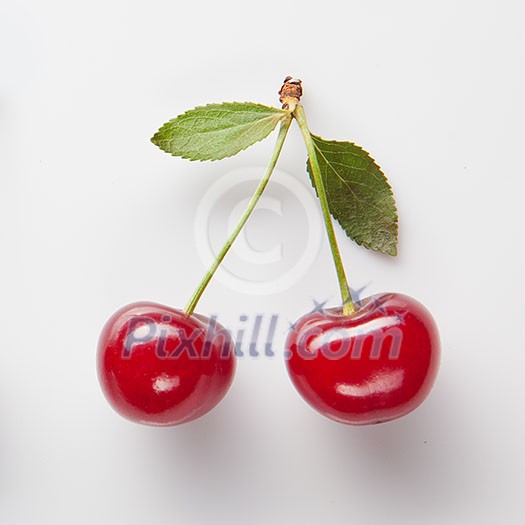 Red cherry with leaves on white Red cherry with leaves on white