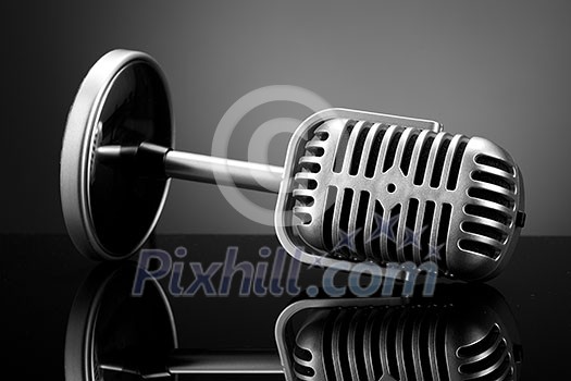Retro microphone on grey Retro microphone on grey
