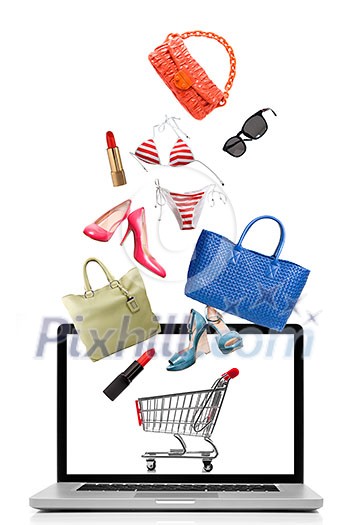 Things to buy falling into notebook isolated on white. Shopping concept Things to buy falling into notebook isolated on white. Shopping concept