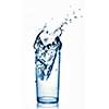 water splash in glass isolated on white