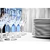glass goblets and plates on the table