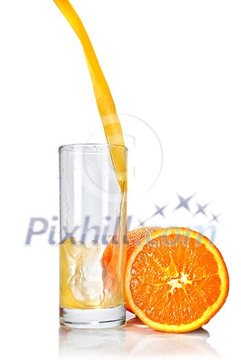 orange juice poring into glass isolated on white orange juice poring into glass isolated on white