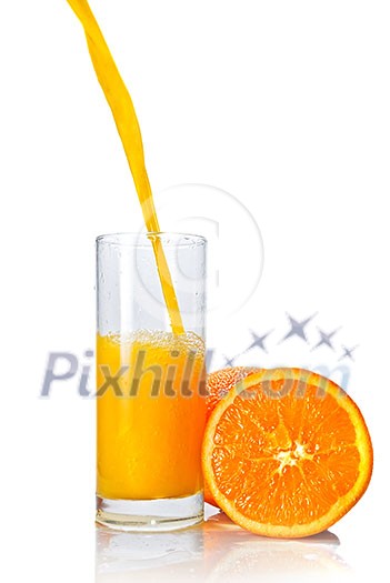 orange juice poring into glass isolated on white orange juice poring into glass isolated on white
