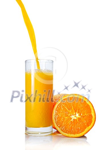 orange juice poring into glass isolated on white orange juice poring into glass isolated on white