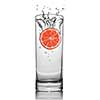 Grapefruit dropped into water glass with splash isolated on white