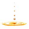 drop falling into orange water with splash isolated on white
