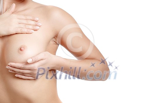 Young Caucasian adult woman examining her breast for lumps or signs of breast cancer Young Caucasian adult woman examining her breast for lumps or signs of breast cancer