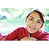 happy young beautiful woman face portrait outdoor in natura