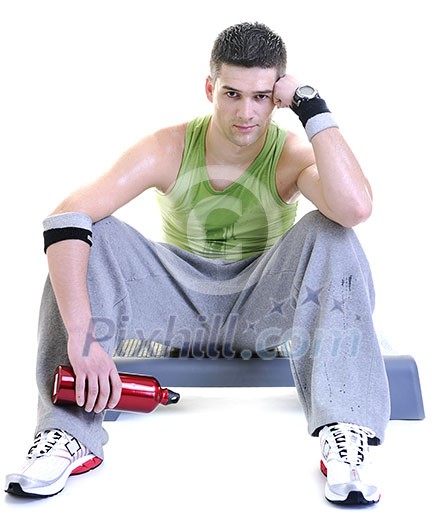 young adult man relax and drink water with sweat on body young adult man relax and drink water with sweat on body