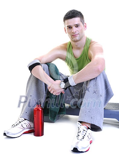 young adult man relax and drink water with sweat on body young adult man relax and drink water with sweat on body