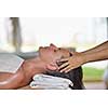 portrait of young beautiful woman in spa environment