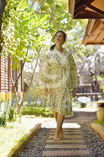 Woman getting spa treatment at tropical resort Woman getting spa treatment at tropical resort