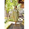 Woman getting spa treatment at tropical resort