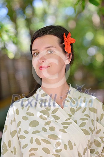 Woman getting spa treatment at tropical resort Woman getting spa treatment at tropical resort