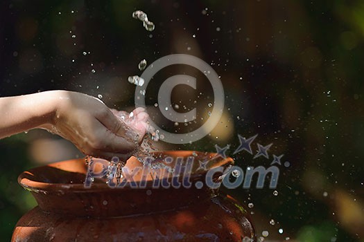 splashing fresh water drops on girl soft skin care for sensuality woman hands splashing fresh water drops on girl soft skin care for sensuality woman hands