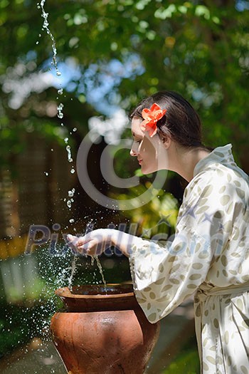 Woman getting spa treatment at tropical resort Woman getting spa treatment at tropical resort