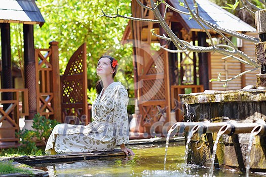 Woman getting spa treatment at tropical resort Woman getting spa treatment at tropical resort